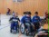 Das Bild zeigt mehrere Schüler im Rollstuhl sitzend in der Turnhalle.